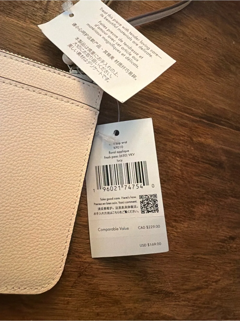 kate spade pale pink zip-around wallet